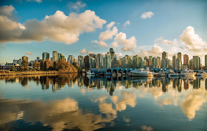 Vancouver city skyline and clouds, with reflections on the water