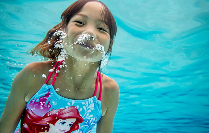 girl swimming at Disney World