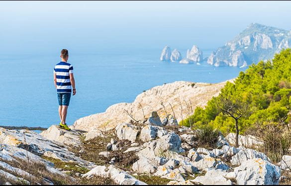 Man overlooking ocean along Amalfi coast