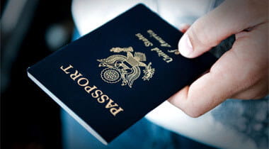 Person hand holding a passport